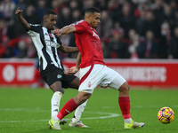 Murillo of Nottingham Forest shields the ball from Alexander Isak of Newcastle United during the Premier League match between Nottingham For...