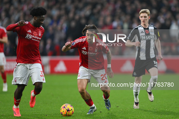 Ola Aina of Nottingham Forest and Jota Silva of Nottingham Forest participate in the Premier League match between Nottingham Forest and Newc...