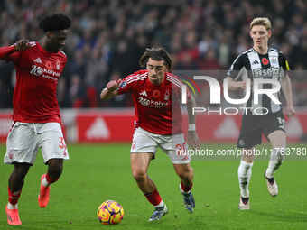 Ola Aina of Nottingham Forest and Jota Silva of Nottingham Forest participate in the Premier League match between Nottingham Forest and Newc...