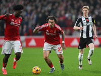 Ola Aina of Nottingham Forest and Jota Silva of Nottingham Forest participate in the Premier League match between Nottingham Forest and Newc...