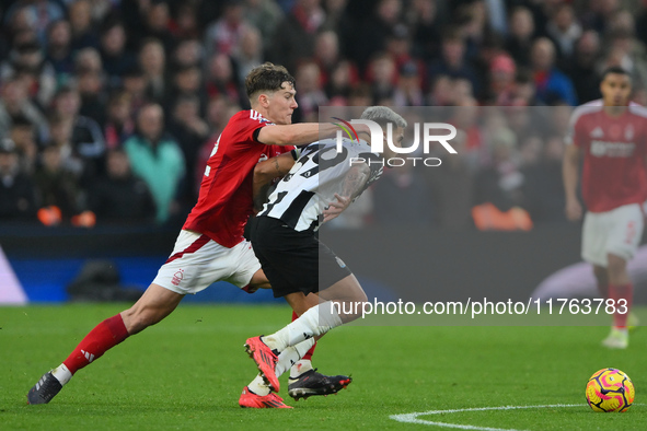 Ryan Yates of Nottingham Forest competes with Bruno Guimaraes of Newcastle United during the Premier League match between Nottingham Forest...