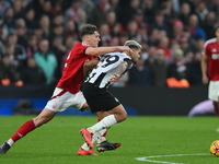 Ryan Yates of Nottingham Forest competes with Bruno Guimaraes of Newcastle United during the Premier League match between Nottingham Forest...