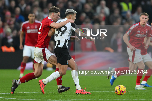 Ryan Yates of Nottingham Forest puts pressure on Bruno Guimaraes of Newcastle United during the Premier League match between Nottingham Fore...