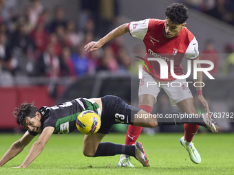 Vitor Carvalho of SC Braga competes for the ball with Daniel Braganca of Sporting CP during the Liga Portugal Betclic match between SC Braga...