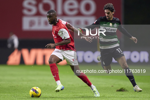 Francisco Trincao of Sporting CP competes for the ball with Sikou Niakate of SC Braga during the Liga Portugal Betclic match between SC Brag...