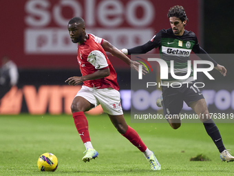 Francisco Trincao of Sporting CP competes for the ball with Sikou Niakate of SC Braga during the Liga Portugal Betclic match between SC Brag...