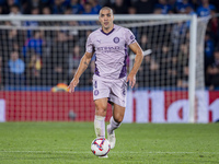 Oriol Romeu of Girona FC is in action with the ball during the La Liga EA Sports 2024/25 football match between Getafe CF and Girona FC at E...