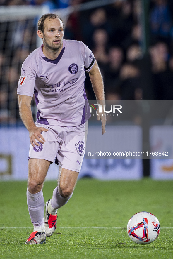 Daley Blind of Girona FC is in action with the ball during the La Liga EA Sports 2024/25 football match between Getafe CF and Girona FC at E...