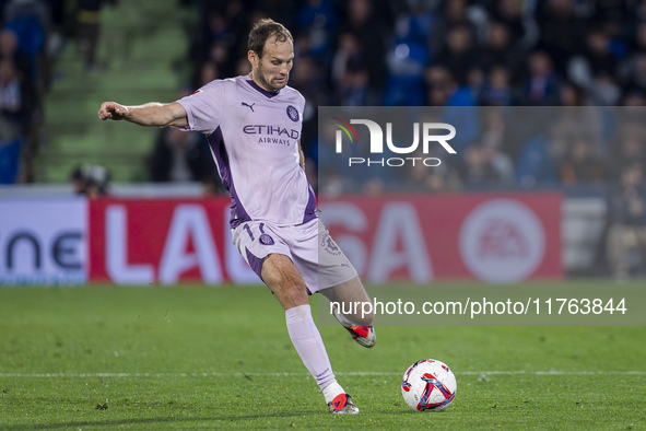 Daley Blind of Girona FC is in action with the ball during the La Liga EA Sports 2024/25 football match between Getafe CF and Girona FC at E...