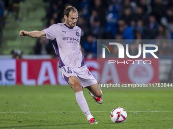 Daley Blind of Girona FC is in action with the ball during the La Liga EA Sports 2024/25 football match between Getafe CF and Girona FC at E...