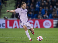 Daley Blind of Girona FC is in action with the ball during the La Liga EA Sports 2024/25 football match between Getafe CF and Girona FC at E...