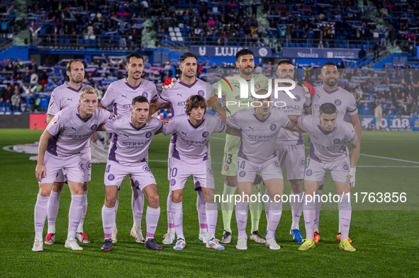 Players of Girona FC pose for the official photo during the La Liga EA Sports 2024/25 football match between Getafe CF and Girona FC at Esta...