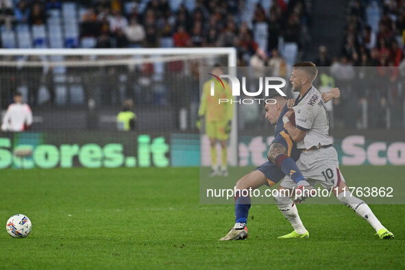 Gianluca Mancini of A.S. Roma and Jesper Karlsson of Bologna F.C. are in action during the 12th day of the Serie A Championship between A.S....