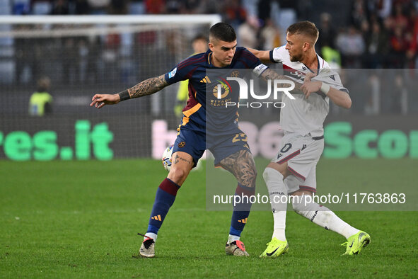 Gianluca Mancini of A.S. Roma and Jesper Karlsson of Bologna F.C. are in action during the 12th day of the Serie A Championship between A.S....