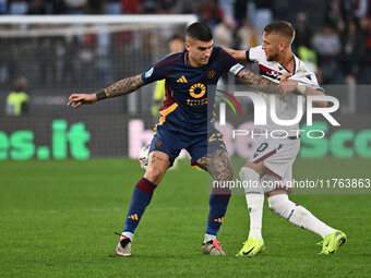 Gianluca Mancini of A.S. Roma and Jesper Karlsson of Bologna F.C. are in action during the 12th day of the Serie A Championship between A.S....