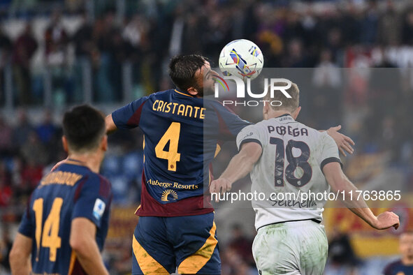 Bryan Cristante of A.S. Roma and Tommaso Pobega of Bologna F.C. are in action during the 12th day of the Serie A Championship between A.S. R...