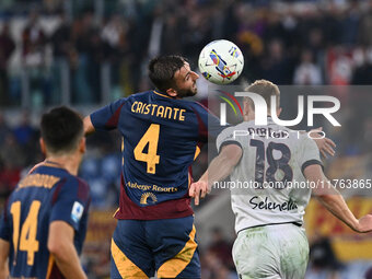 Bryan Cristante of A.S. Roma and Tommaso Pobega of Bologna F.C. are in action during the 12th day of the Serie A Championship between A.S. R...