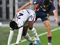 Jhon Lucumi of Bologna F.C. and Eldor Shomurodov of A.S. Roma are in action during the 12th day of the Serie A Championship between A.S. Rom...