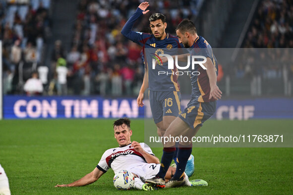 Thijs Dallinga of Bologna F.C., Leandro Paredes of A.S. Roma, and Bryan Cristante of A.S. Roma are in action during the 12th day of the Seri...