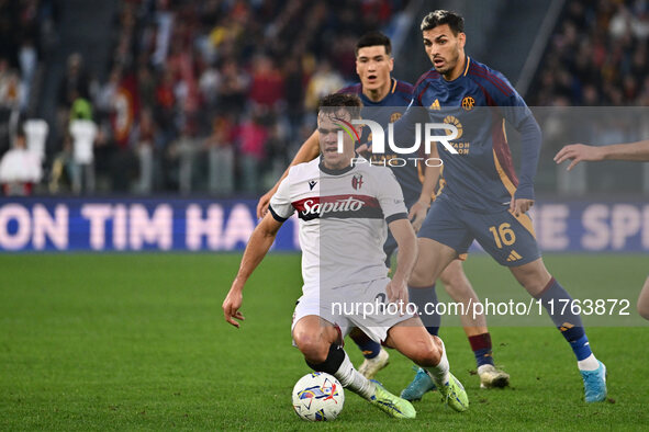 Thijs Dallinga of Bologna F.C., Leandro Paredes of A.S. Roma, and Bryan Cristante of A.S. Roma are in action during the 12th day of the Seri...