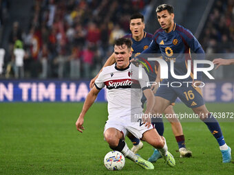 Thijs Dallinga of Bologna F.C., Leandro Paredes of A.S. Roma, and Bryan Cristante of A.S. Roma are in action during the 12th day of the Seri...