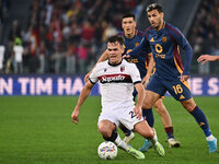 Thijs Dallinga of Bologna F.C., Leandro Paredes of A.S. Roma, and Bryan Cristante of A.S. Roma are in action during the 12th day of the Seri...