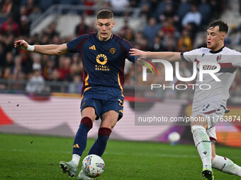 Artem Dovbyk of A.S. Roma and Sam Beukema of Bologna F.C. are in action during the 12th day of the Serie A Championship between A.S. Roma an...