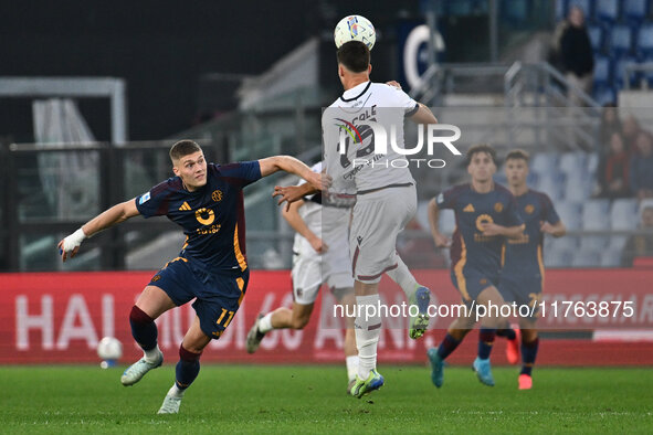 Artem Dovbyk of A.S. Roma and Nicolo Casale of Bologna F.C. are in action during the 12th day of the Serie A Championship between A.S. Roma...