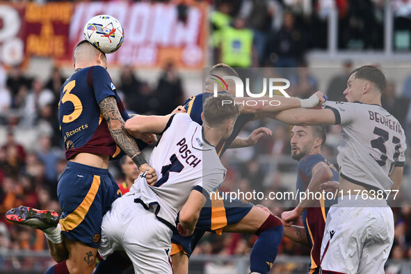 Gianluca Mancini of A.S. Roma, Stefan Posch of Bologna F.C., Artem Dovbyk of A.S. Roma, and Sam Beukema of Bologna F.C. are in action during...