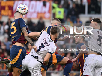 Gianluca Mancini of A.S. Roma, Stefan Posch of Bologna F.C., Artem Dovbyk of A.S. Roma, and Sam Beukema of Bologna F.C. are in action during...