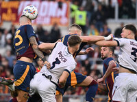 Gianluca Mancini of A.S. Roma, Stefan Posch of Bologna F.C., Artem Dovbyk of A.S. Roma, and Sam Beukema of Bologna F.C. are in action during...