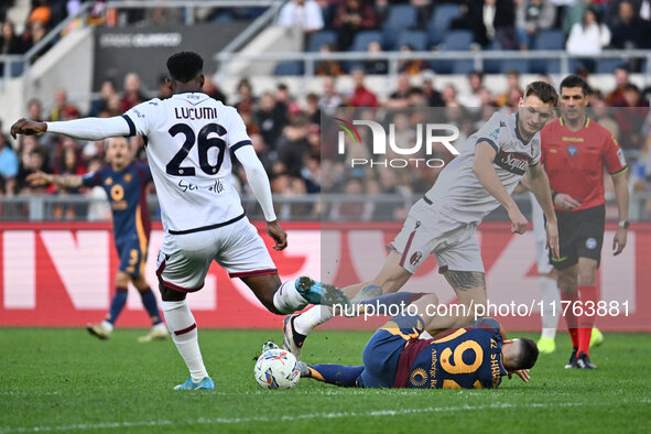 Jhon Lucumi of Bologna F.C., Stephan El Shaarawy of A.S. Roma, and Stefan Posch of Bologna F.C. are in action during the 12th day of the Ser...