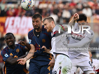 Evan Ndicka of A.S. Roma, Bryan Cristante of A.S. Roma, Remo Freuler of Bologna F.C., and Santiago Castro of Bologna F.C. are in action duri...