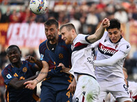 Evan Ndicka of A.S. Roma, Bryan Cristante of A.S. Roma, Remo Freuler of Bologna F.C., and Santiago Castro of Bologna F.C. are in action duri...