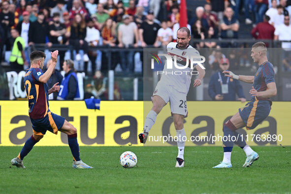 Stephan El Shaarawy of A.S. Roma, Lorenzo De Silvestri of Bologna F.C., and Artem Dovbyk of A.S. Roma are in action during the 12th day of t...