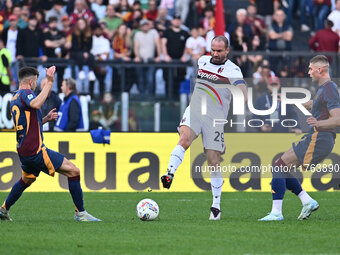 Stephan El Shaarawy of A.S. Roma, Lorenzo De Silvestri of Bologna F.C., and Artem Dovbyk of A.S. Roma are in action during the 12th day of t...