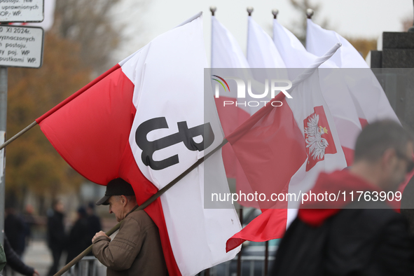 In Warsaw, Poland, on November 10, 2024, people supporting the PiS party with Polish flags participate in the monthly celebrations of the Sm...