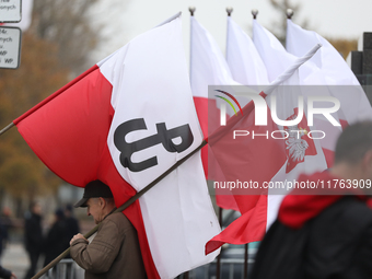 In Warsaw, Poland, on November 10, 2024, people supporting the PiS party with Polish flags participate in the monthly celebrations of the Sm...