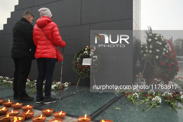 In Warsaw, Poland, on November 10, 2024, Zbigniew Komosa and his wife lay a wreath during the monthly celebrations of the Smolensk disaster...