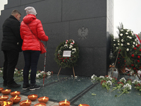 In Warsaw, Poland, on November 10, 2024, Zbigniew Komosa and his wife lay a wreath during the monthly celebrations of the Smolensk disaster...