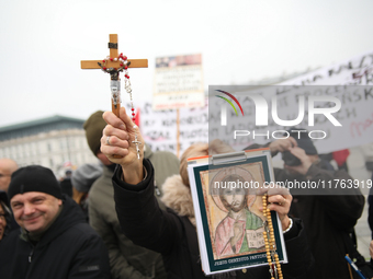 In Warsaw, Poland, on November 10, 2024, people supporting the PiS party participate in the monthly celebrations of the Smolensk disaster at...