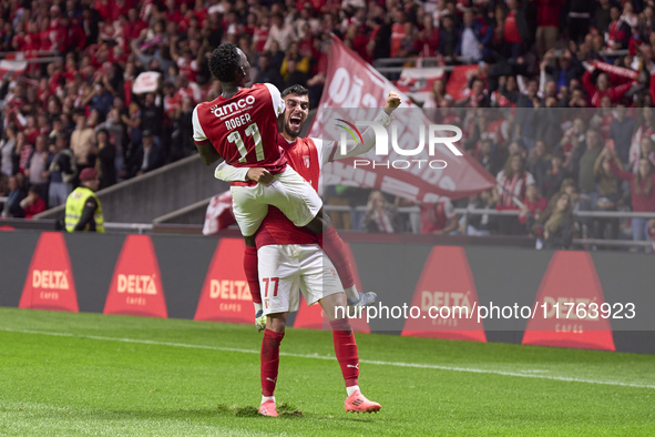 Gabri Martinez (R) and Roger Fernandes of SC Braga celebrate after Ricardo Horta (not in frame) scores their side's second goal during the L...