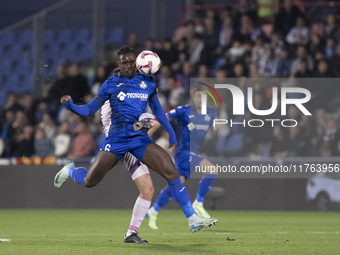 In Madrid, Spain, on November 10, Christantus Uche of Getafe and Arnau Martinez of Girona fight for the ball during the La Liga 2024/25 matc...