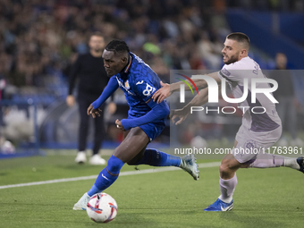 In Madrid, Spain, on November 10, Christantus Uche of Getafe and David Lopez of Girona fight for the ball during the La Liga 2024/25 match b...