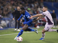 In Madrid, Spain, on November 10, Christantus Uche of Getafe and David Lopez of Girona fight for the ball during the La Liga 2024/25 match b...