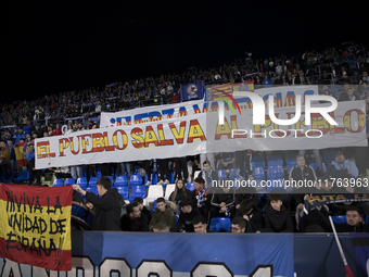 In Madrid, Spain, on November 10, Getafe fans display a flag that says ''el pueblo salva al pueblo'' during the La Liga 2024/25 match betwee...