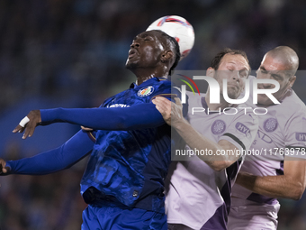 In Madrid, Spain, on November 10, Christantus Uche of Getafe and Daley Blind of Girona fight for the ball during the La Liga 2024/25 match b...