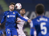 In Madrid, Spain, on November 10, Yellu Santiago of Getafe and Yangel Herrera of Girona fight for the ball during the La Liga 2024/25 match...