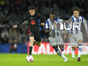 Pedri central midfield of Barcelona and Spain and Sheraldo Becker centre-forward of Real Sociedad and Netherlands compete for the ball durin...