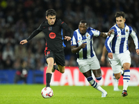 Pedri central midfield of Barcelona and Spain and Sheraldo Becker centre-forward of Real Sociedad and Netherlands compete for the ball durin...